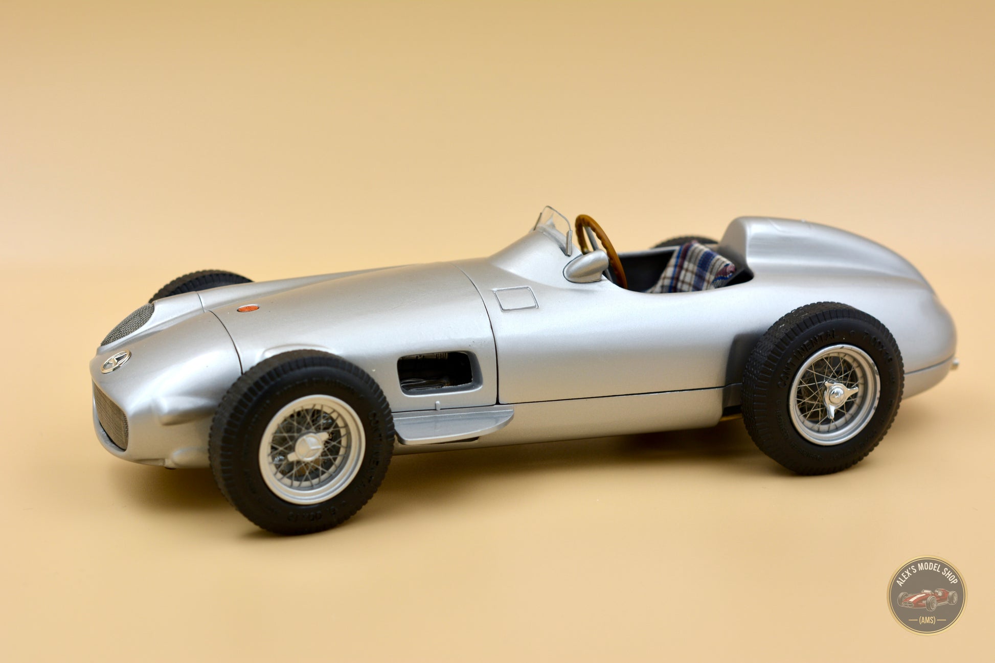 CMC M-006 — Mercedes-Benz W196 Monoposto 1954, rear three-quarter view, left side, 1:18 scale diecast model