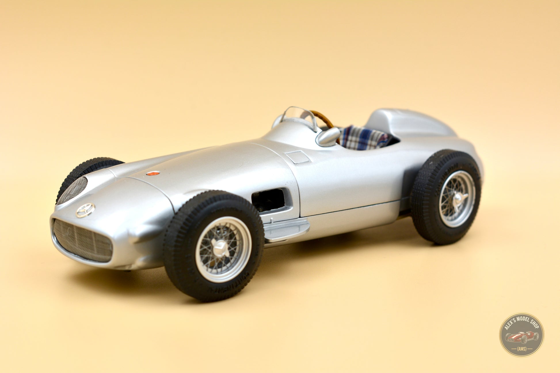 CMC M-006 — Mercedes-Benz W196 Monoposto 1954, rear three-quarter view, left side, alternate angle, 1:18 scale diecast model
