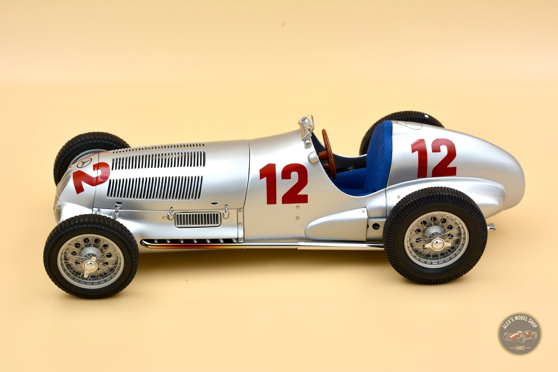 CMC 1:18 Mercedes-Benz W125 #12, Rudolf Caracciola (1937) — right side profile with exhaust pipes